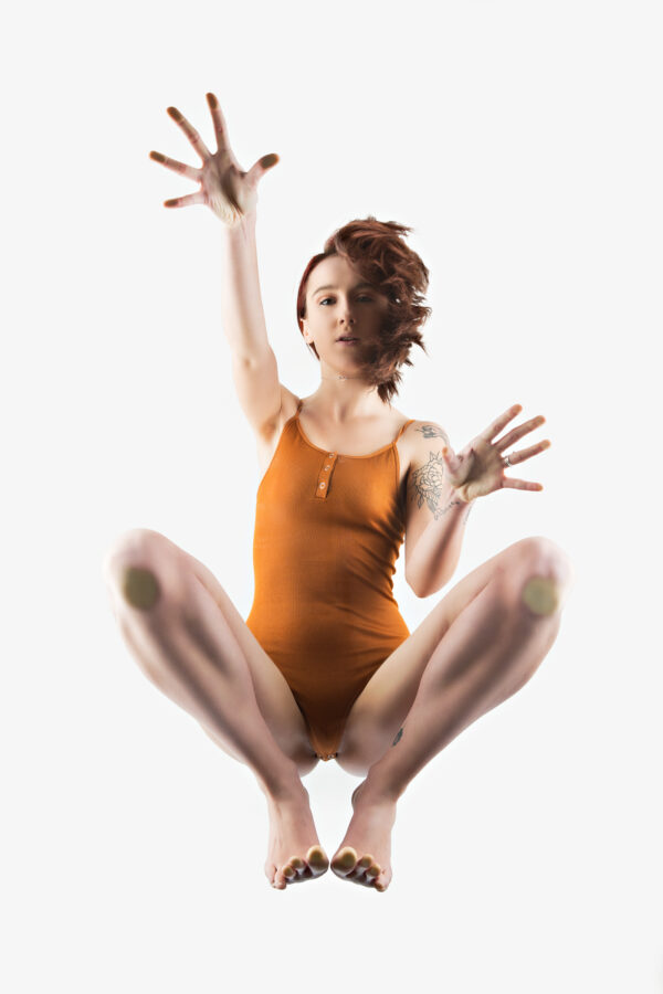 myrra-hixson-orange-brown-body-suit-seen-from-below-denver-colorade