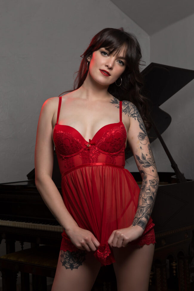 kennedy-h-flashing-a-bit-of-red-babydoll-baby-grand-piano-norman-ok