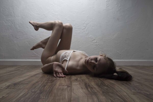 angel-posing-on-wooden-floor-with-white-shawnee-ok