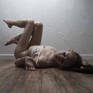 angel-posing-on-wooden-floor-with-white-shawnee-ok