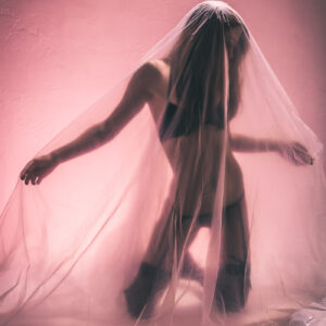 Shelby Parton encased in plastic with light and colors Subtle Shades Photography