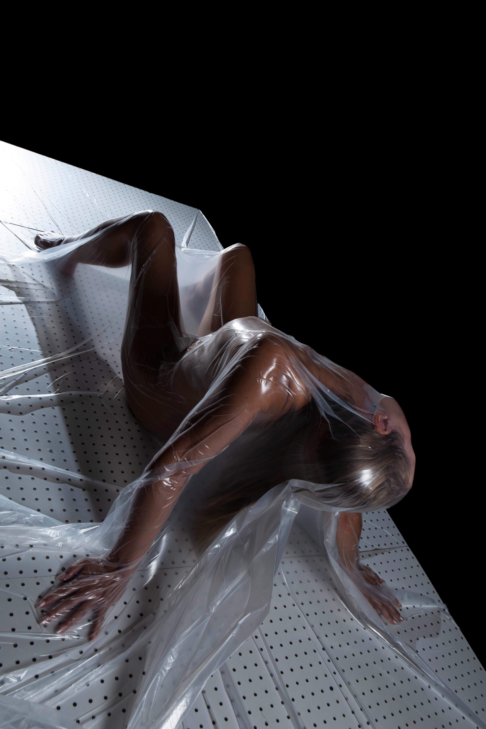 Marie Brooks vacuum sealed portrait session creative dark art shoot traveling model