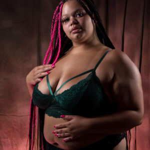 Kylee The Model emerald green boudoir shoot on red backdrop Oklahoma City, OK
